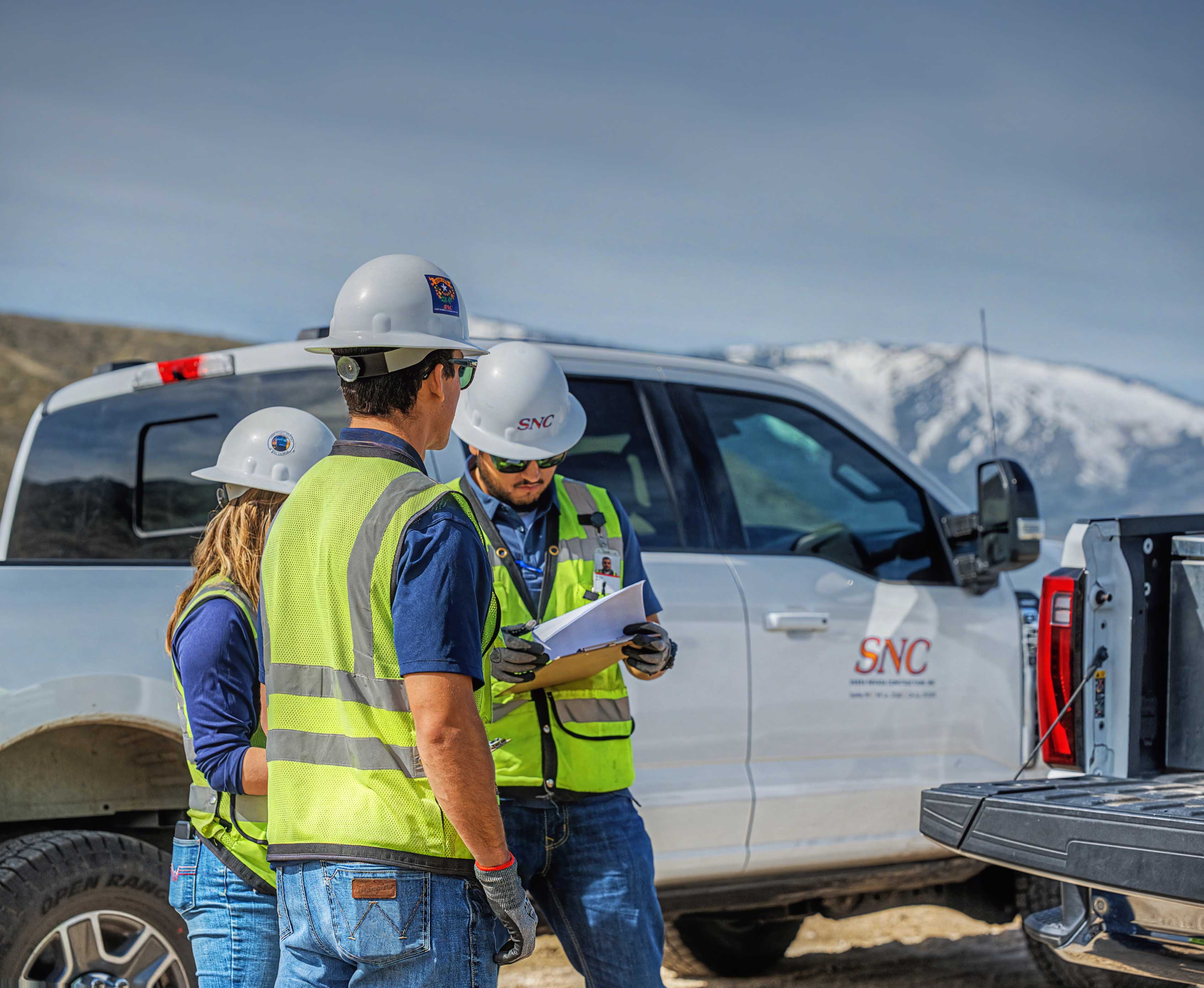 snc crew reviewing plans nevada job site